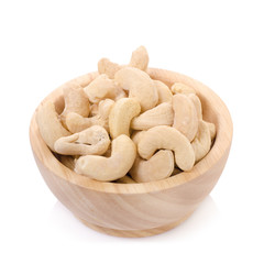 Cashew Nuts in wood bowl isolated on white background