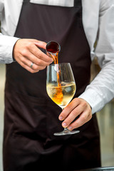 Barman making cocktail