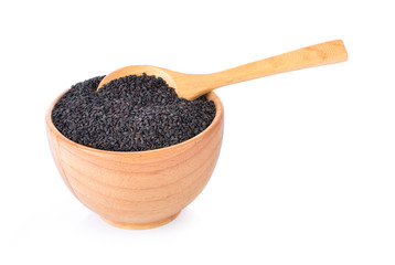 poppy seeds in a wooden bowl on a white background