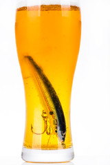 fishing bait wobbler in glass with beer