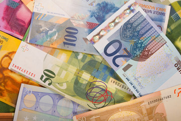 Swiss francs and euro banknotes