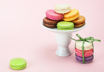 Colorful macaroon on a pink background.  Dessert