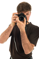 Young professional photographer shooting in the studio