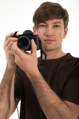 Young professional photographer shooting in the studio