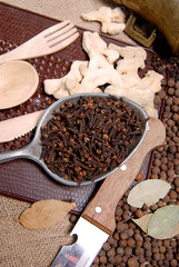 cloves in a spoon and ginger 2