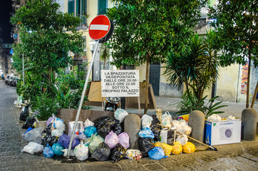 view of pile of trash situated inside of italian city naples - napoli.