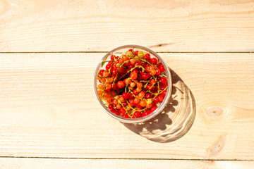 Red currants in a glass jar top view