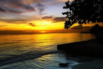 Fototapeta na wymiar Yellow Sunset over the Coastline
