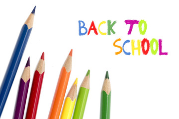 colored pencils isolated on white and text back to school