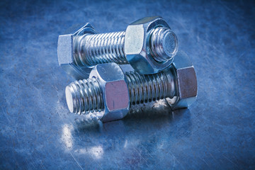 Set of metal screwbolts and screw-nuts construction concept