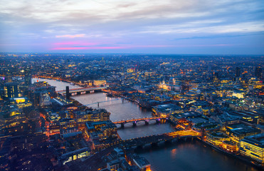 Fototapeta na wymiar LONDON, UK - APRIL 15, 2015: City of London panorama at sunset, arial view