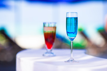 Colorful exotic tasty cocktails in outdoor cafe