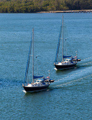 Two sail boats navigating