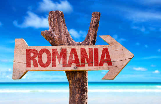 Romania wooden sign with beach background