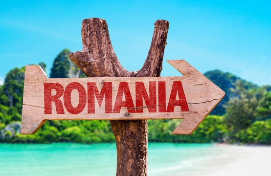 Romania wooden sign with beach background