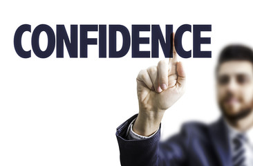 Business man pointing the text: Confidence