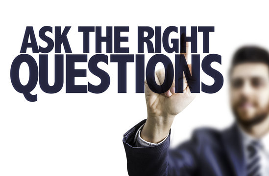 Business man pointing the text: Ask The Right Questions