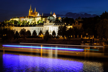 Fototapeta na wymiar Prague castle in Hradcany with Vlatava river and lights from boats