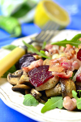 Beet salad with arugula,mushrooms and smoked bacon .