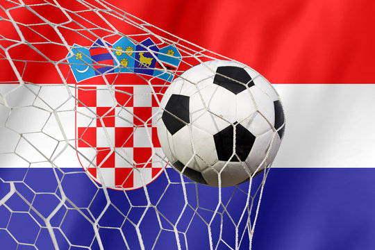 Croatia waving flag and soccer ball in goal net