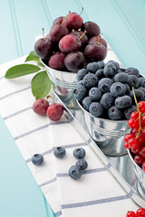 Cherries in blue wooden table