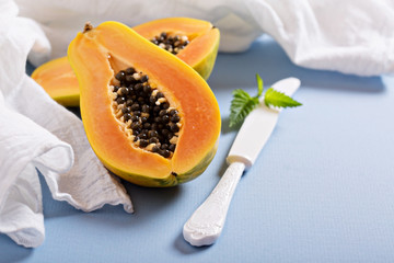 Cut papaya on a blue table