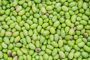 Green olives texture from top view