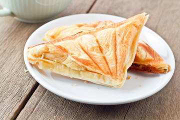 Tuna puff. Tuna sandwich on wood table.
