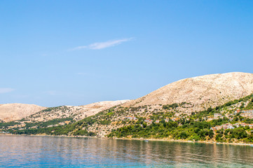 Beautiful Mediterranean landscape with rocky hills and clear blue sea