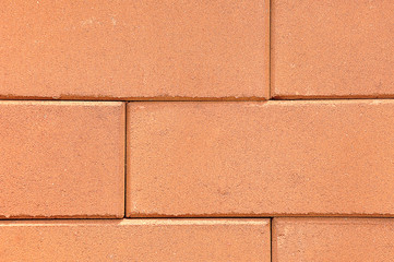 Lines of red clay bricks stack