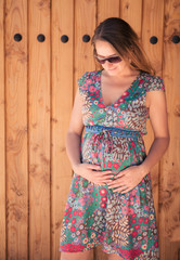 Fototapeta premium Pregnant woman with her hands on her baby