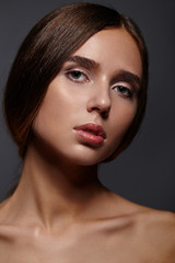 Fototapeta premium Portrait of beautiful female model on grey background