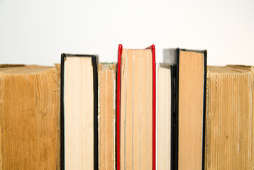 A few old books are next to each other
