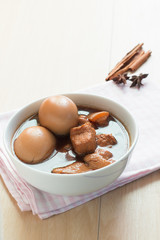 Thai Cuisine , Boiled eggs with chicken drumstick in sweet gravy.Eggs and pork in brown sauce.