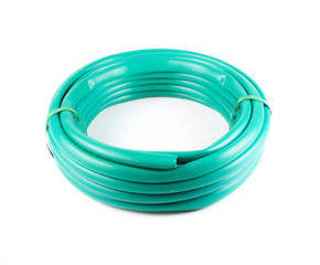 Rolled garden hose isolated on white