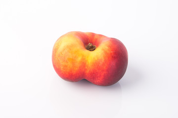 flat peaches (donut peaches) on a background
