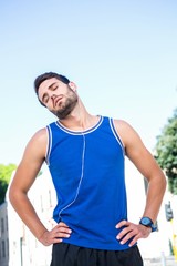 Naklejka premium Handsome athletic stretching his neck