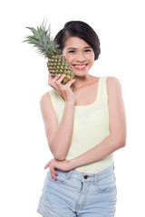 Woman with fresh pineapple