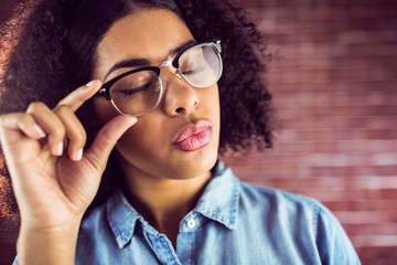 Attractive hipster sending air kiss