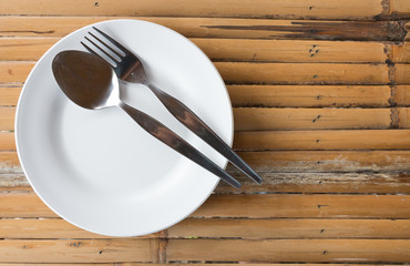 empty dish with spoon and fork
