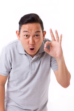 happy, exited man giving ok hand sign gesture