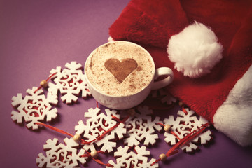 Santas hat and cup of coffee with heart shape