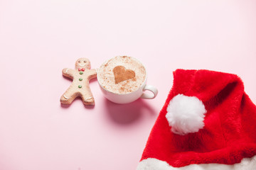 Cup of coffee with heart shape and gingerbread