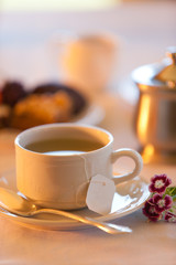 Hot tea in early morning sunlight.