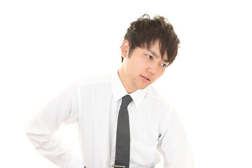 疲れた表情のビジネスマン