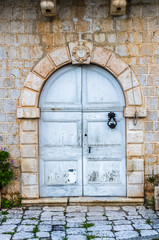 Fototapeta na wymiar White wooden door in old house