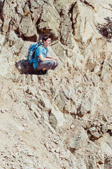 Teenager sitting on the hillside