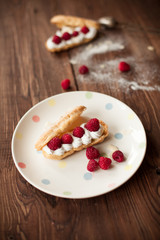 Fruit dessert on white plate on wood table