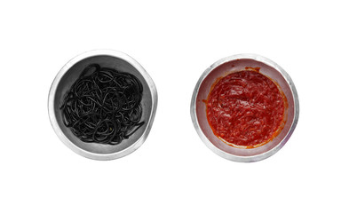black spaghetti and red sauce in metal cup on white background