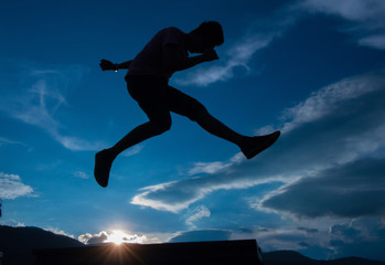 Fototapeta na wymiar Silhouette of a jumping